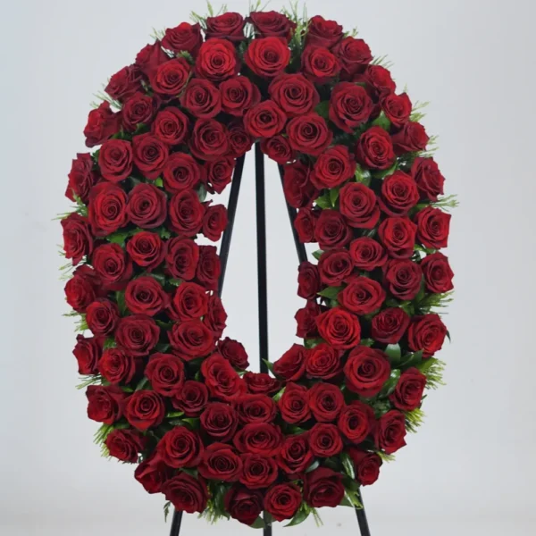 დიდი ოვალური სამგლოვიარო გვირგვინი 100 წითელი ვარდით